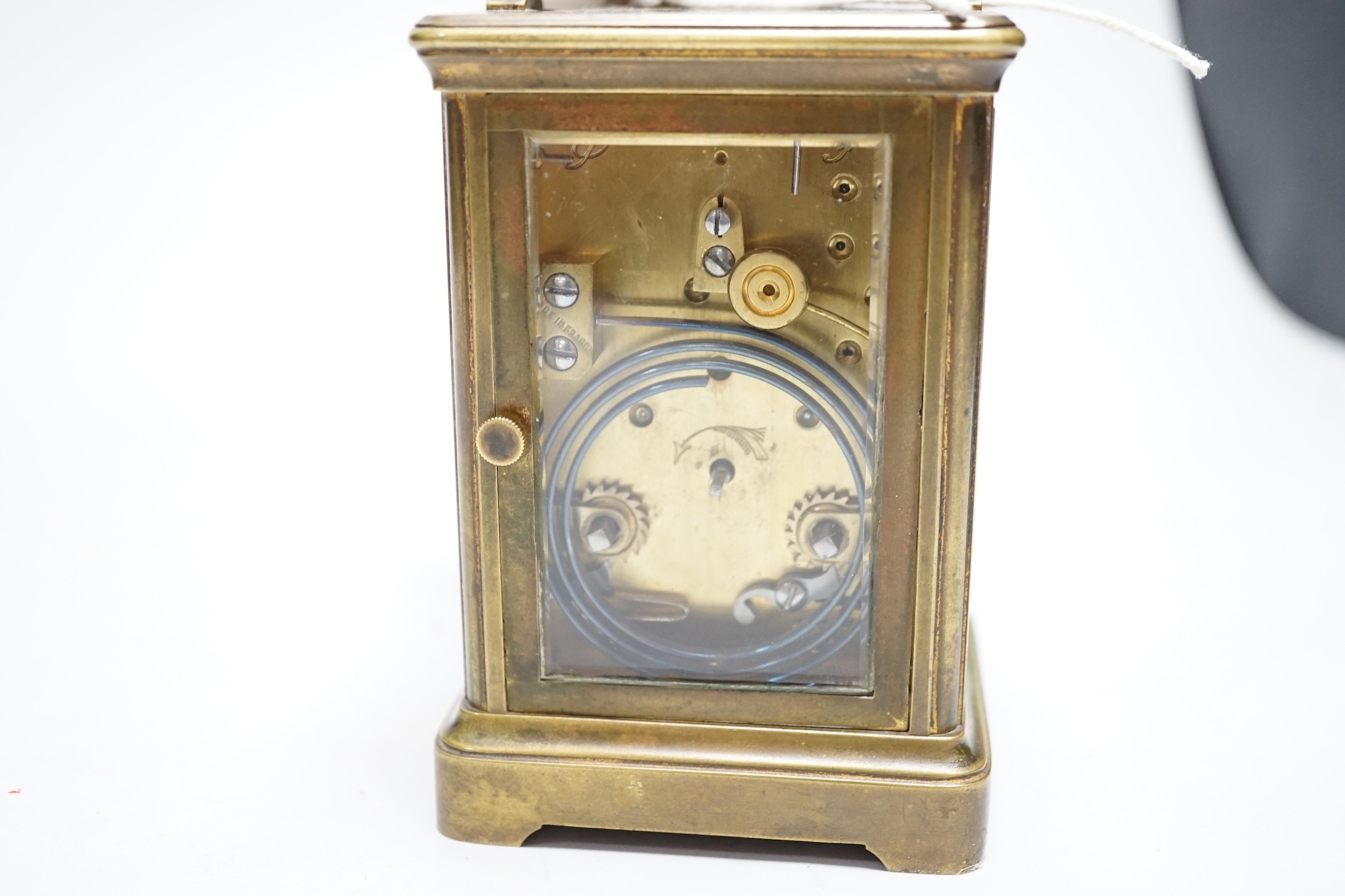 A striking carriage clock, 12cm tall